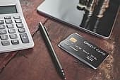 credit card, tablet and pen