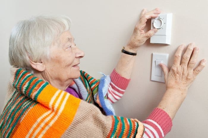 old woman thermostat energy