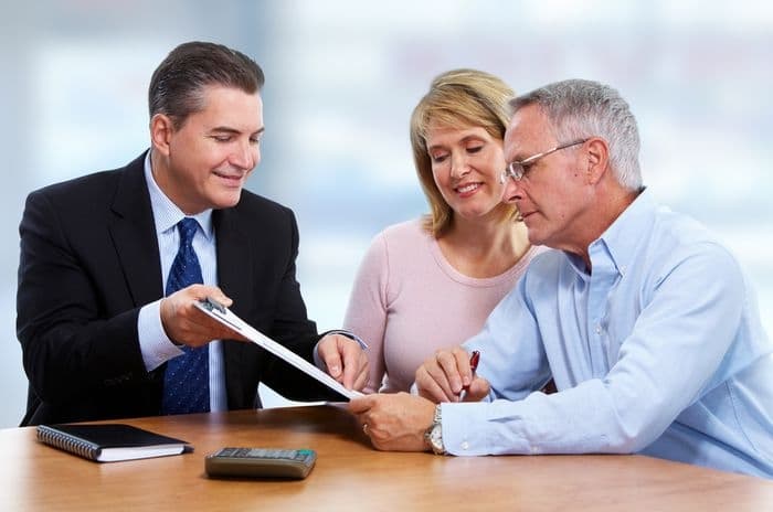 insurance agent with senior couple