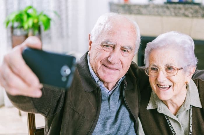 older couple using smartphone