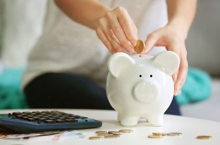 savings piggy bank and calculator
