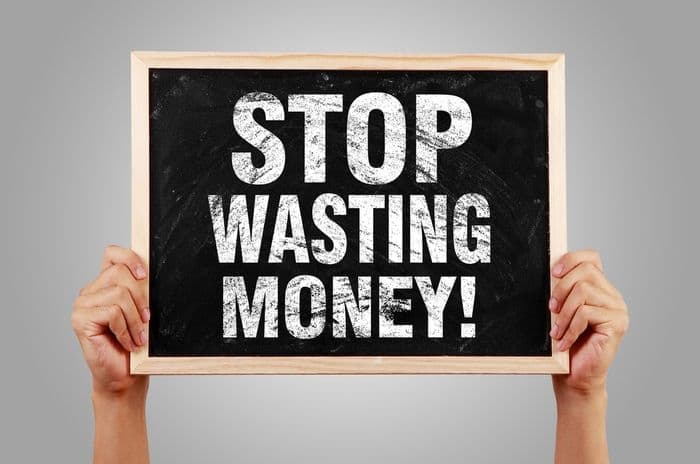 stop wasting money sign
