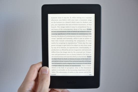 Kindle Paperwhite in hand